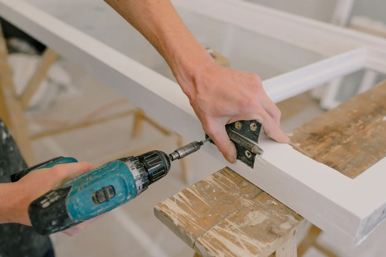 Adjusting door hardware during a minor repair visit