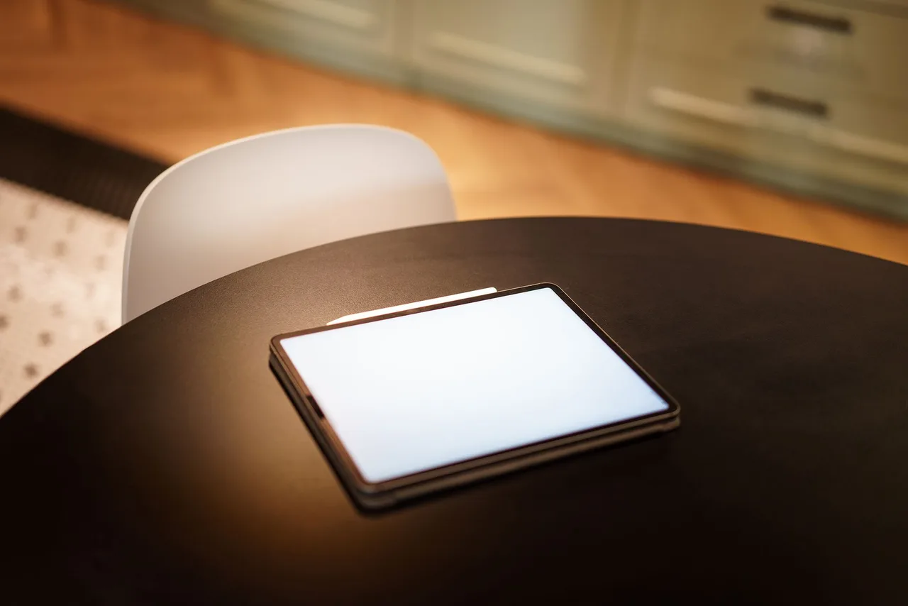 Tablet showing property notes in a modern kitchen