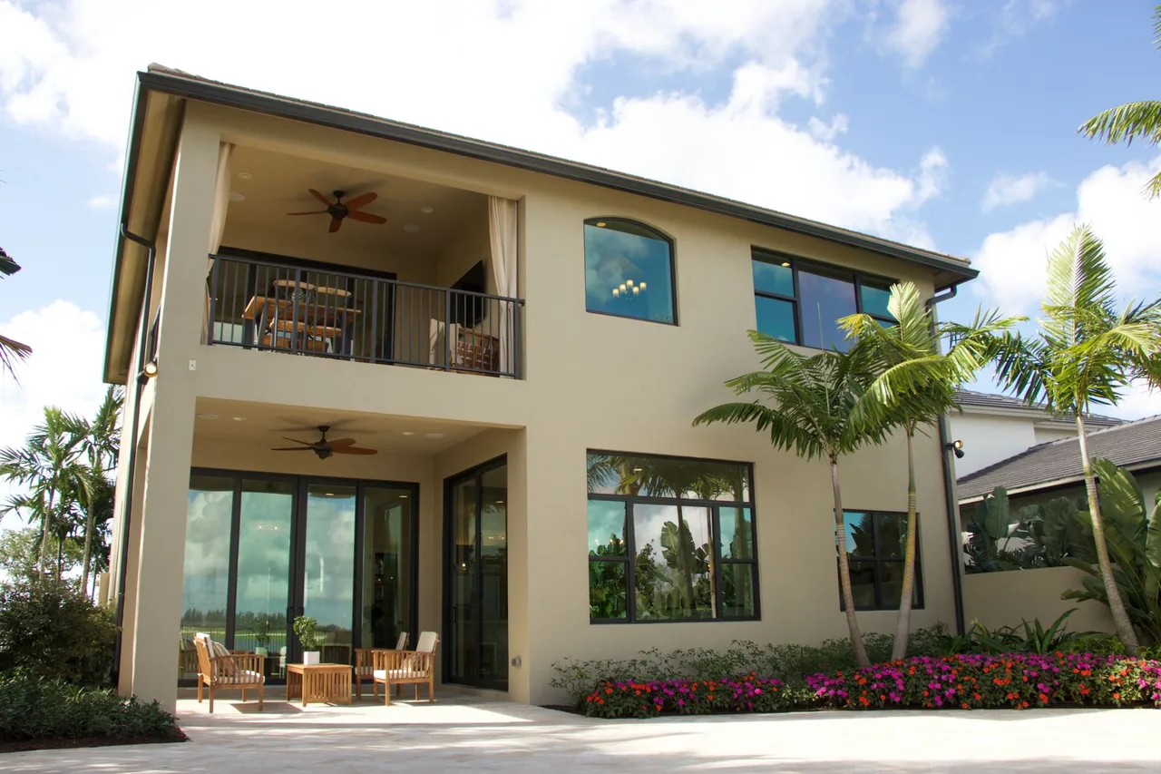 Coastal residential street with beachfront homes steps from the sand on a sunny day